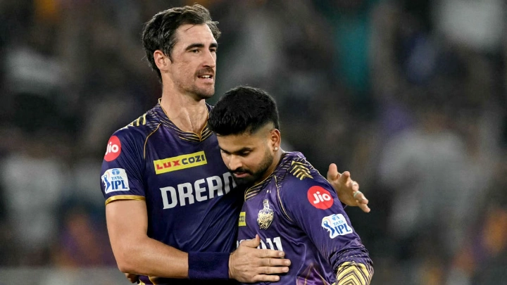 Kolkata Knight Riders' Mitchell Starc celebrates with captain Shreyas Iyer after taking the wicket of Sunrisers Hyderabad's Nitish Kumar Reddy during the Indian Premier League (IPL) match at the Narendra Modi Stadium in Ahmedabad on May 21, 2024. PHOTO: AFP