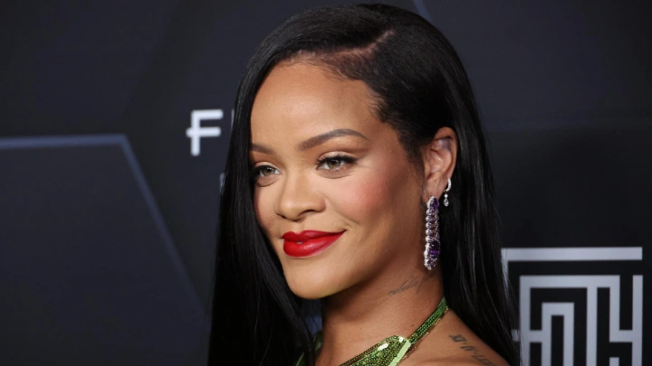 In this file photo taken on 11 February, 2022 Rihanna poses for a picture as she celebrates her beauty brands fenty beauty and fenty skin at Goya Studios in Los Angeles, California.