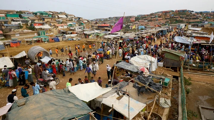 Rohingya refugees gather at a market inside a refugee camp in Cox`s Bazar. Reuters file photo