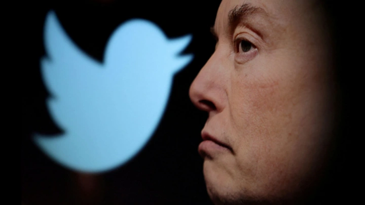 Twitter logo and a photo of Elon Musk are displayed through magnifier in this illustration taken October 27, 2022. REUTERS