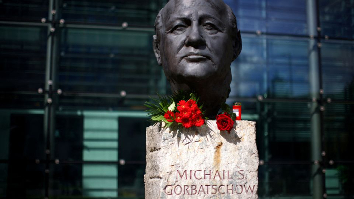 Roses are placed on a sculpture of Mikhail Gorbachev in memory of the final leader of the Soviet Union, at the "Fathers of Unity" memorial in Berlin, Germany 