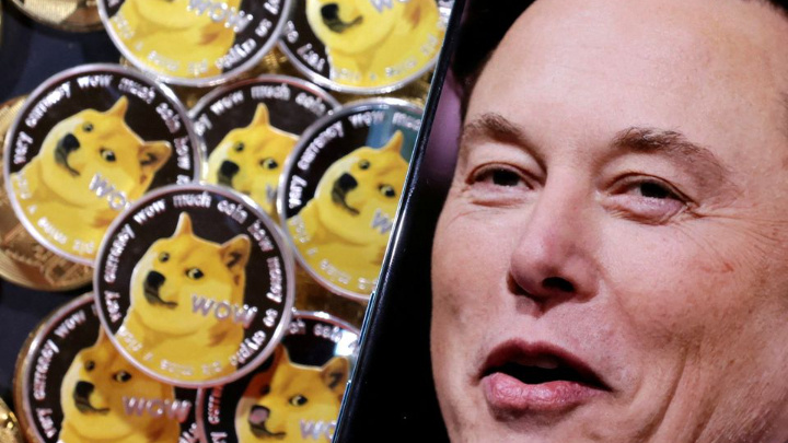 A photo of Elon Musk is displayed on a smartphone placed on representations of cryptocurrency Dogecoin in this illustration taken June 16, 2022. REUTERS/Dado Ruvic/Illustration/File Photo