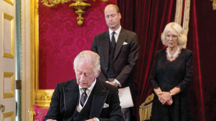 Charles III proclaimed king vowing to follow 'inspiring' queen Britain's Prince William, Prince of Wales (centre) and Britain's Camilla, Queen Consort (right) watch as Britain's King Charles III signs an oath to uphold the security of the Church in Scotland, during a meeting of the Accession Council inside St James's Palace in London on Saturday, to proclaim him as the new King (AFP photo)