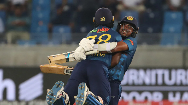 Sri Lanka's Asitha Fernando (L) and Maheesh Theekshana celebrate their win over Bangladesh in the Asia Cup Group B match at the Dubai International Cricket Stadium in the UAE on 1 September, 2022AFP