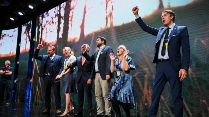 Members of the anti-immigration nationalist party Sweden Democrats celebrate what is set to be their best election result yet JONATHAN NACKSTRAND / AFP