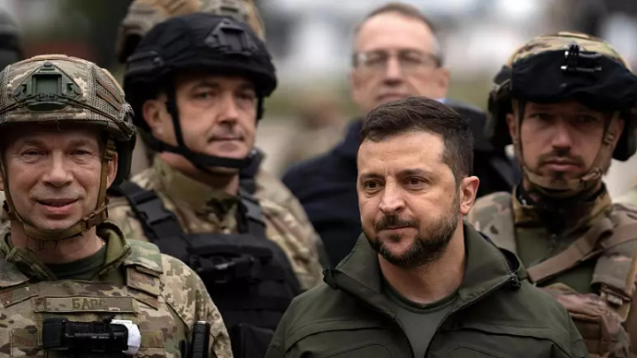 Ukrainian President Volodymyr Zelenskyy poses for a photo with soldiers after attending a national flag-raising ceremony in the freed Izium, Ukraine, Wednesday, Sept. 14, 2022   -   Copyright  AP Photo / Leo Correa