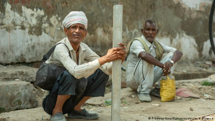 Many Indian men depend on the informal economy. These laborers wait for work, which isn't guaranteed