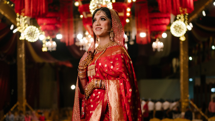 Fariha Tasnim in vermilion red Sabyasachi Benarasi on her wedding day. Photos: Courtesy