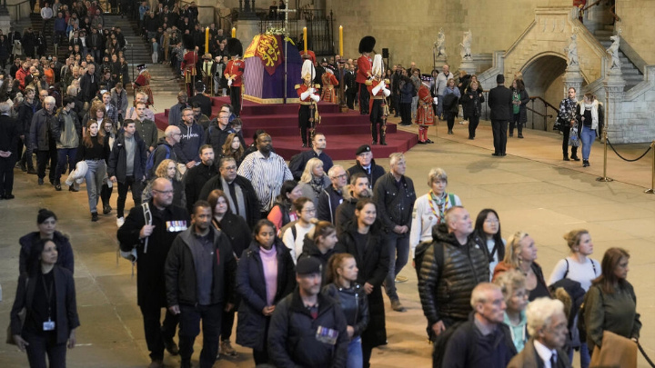 Members of the public file past the coffin of Queen Elizabeth II, lying in state on the catafalque in Westminster Hall on 18 September 2022 in London. AP - Markus Schreiber