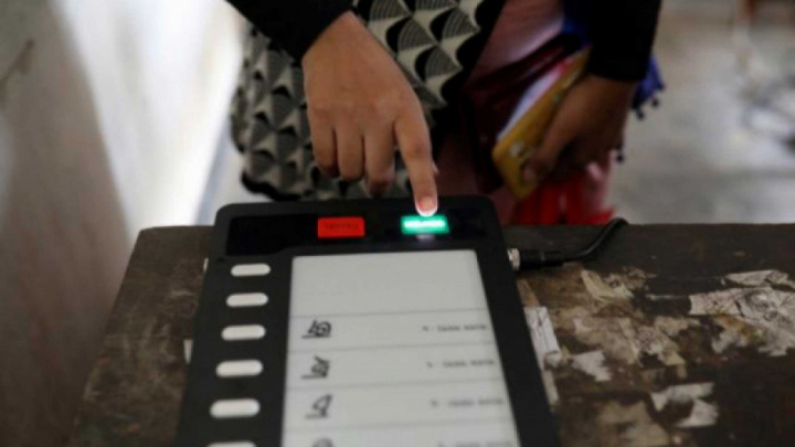 In this file photo, a voter is seen casting their vote on an electronic voting machine. Photo: Reuters/File