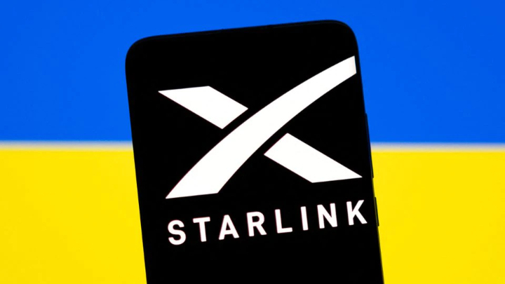 Starlink logo is seen on a smartphone in front of displayed Ukrainian flag in this illustration taken February 27, 2022. REUTERS/Dado Ruvic/Illustration