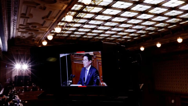 Japan's Prime Minister Fumio Kishida is seen on the monitor of a TV camera while he delivers his policy speech during the first day of an ordinary session at the lower house of parliament in Tokyo, Japan January 23, 2023. REUTERS/Kim Kyung-Hoon
