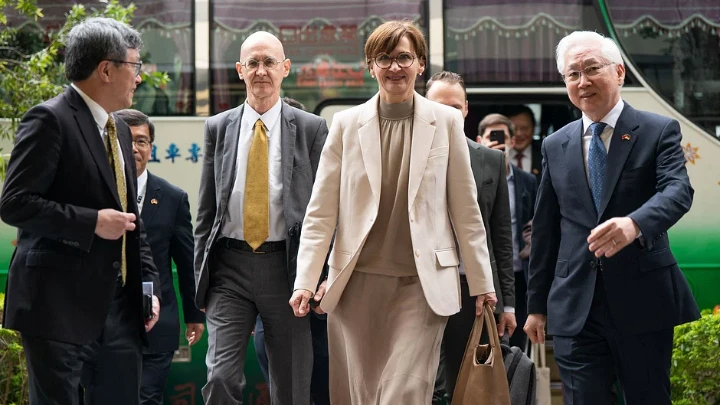 This handout picture taken and released by Taiwan’s National Science and Technology Council (NSTC) on 21 March, 2023 shows German Minister of Education and Research Bettina Stark-Watzinger (C) walking with her Taiwanese counterpart Wu Tsung-tsong (R), Minister of Science and Technology, after arriving at the NSTC in Taipei. AFP