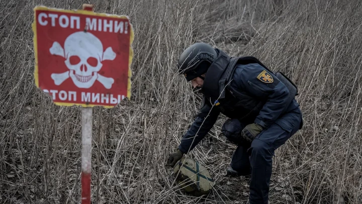 A sapper of the State Emergency Service inspects an area for mines and unexploded shells, as Russia's attack on Ukraine continues, in Kharkiv region, Ukraine March 21, 2023. Reuters