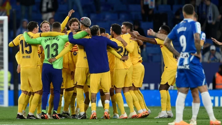 Barcelona wins the La Liga title with a rout of Espanyol.