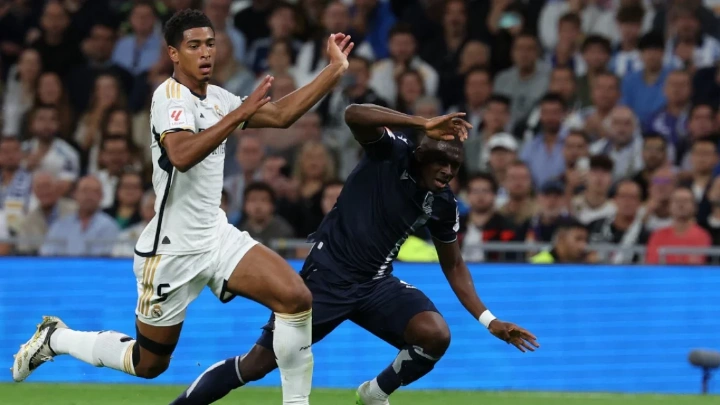 Real Madrid's Jude Bellingham vies with Real Sociedad's Hamari Traore during Sunday’s LaLiga match in Madrid Photo: AFP
