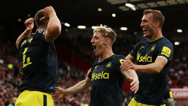 Newcastle United's Sven Botman celebrates scoring their third goal with Anthony Gordon and Dan Burn. Photo: Reuters
