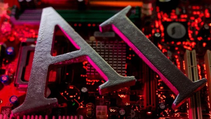 AI (Artificial Intelligence) letters are placed on computer motherboard in this illustration taken June 23, 2023. REUTERS/Dado Ruvic/Illustration/File Photo