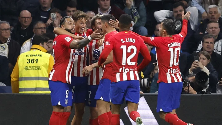 Atletico Madrid's Marcos Llorente celebrates scoring their first goal with teammates. Photo: Reuters