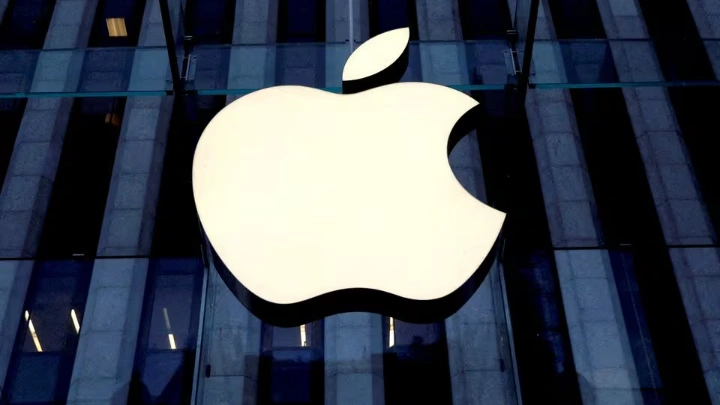 The Apple logo is seen hanging at the entrance to the Apple store on 5th Avenue in Manhattan, New York, U.S., October 16, 2019. REUTERS/Mike Segar/File Photo