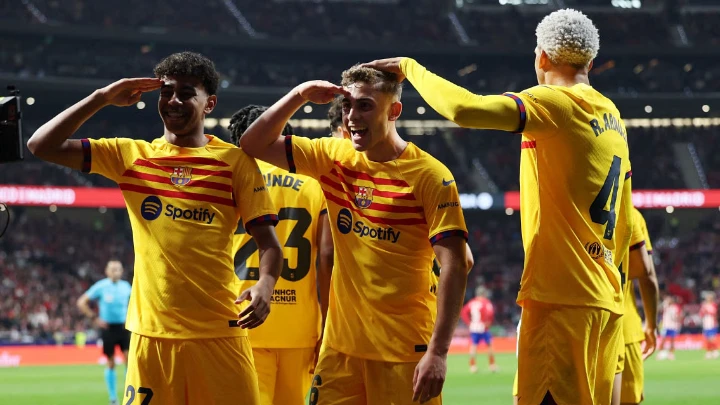 Barcelona's Fermin Lopez celebrates with Lamine Yamal and Ronald Araujo after scoring their third goal. PHOTO: REUTERS