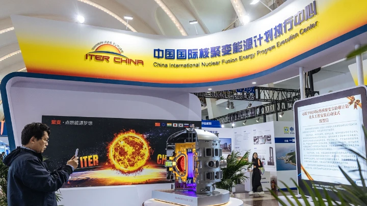 China opens ten nuclear technology research facilities to the world to enhance international cooperation A man takes a photo of an exhibit at the 2024 China International Nuclear Industry Exhibition in Beijing on March 19, 2024. The exhibition is expected to attract the participation of more than 110 renowned domestic and international companies and over 10,000 professionals from more than 10 countries. Photo: Li Hao/GT