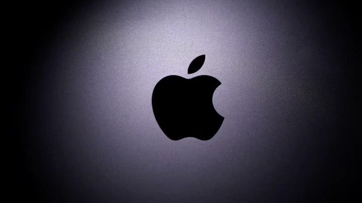 Apple logo is seen on the MacBook in this illustration taken taken April 12, 2020. REUTERS/Dado Ruvic/Illustration/File Photo