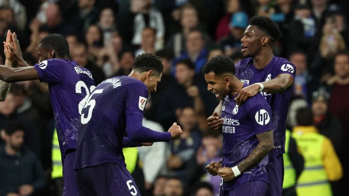 Real Madrid's Brazilian forward #11 Rodrygo (2nd-R) celebrates with teammates after scoring his team's second goal during the Spanish league football match between Girona FC and Real Betis at the Montilivi stadium in Girona on March 31, 2024. Photo: AFP