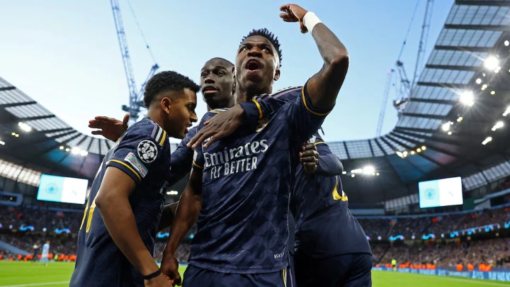 Soccer Football - Champions League - Quarter Final - Second Leg - Manchester City v Real Madrid - Etihad Stadium, Manchester, Britain - April 17, 2024 Real Madrid's Rodrygo celebrates scoring their first goal with Vinicius Junior and teammates REUTERS/Molly Darlington TPX IMAGES OF THE DAY
