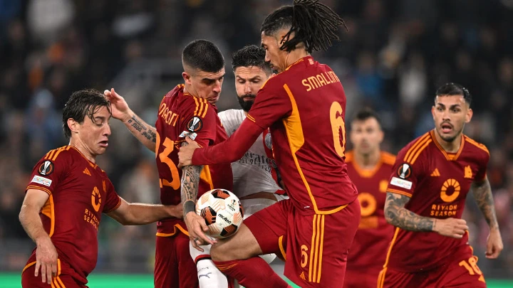 AC Milan's Olivier Giroud in action with AS Roma's Gianluca Mancini and Chris Smalling at Stadio Olimpico in Rome on April 18, 2024. Photo: Reuters