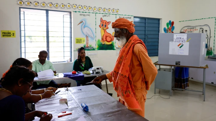 Rama Chandra, 76, a Sadhu or a Hindu holy man, votes at a polling station during the first phase of the general election, at Tiruvannamalai in Tamil Nadu, India, April 19, 2024. REUTERS/ Navesh Chitrakar