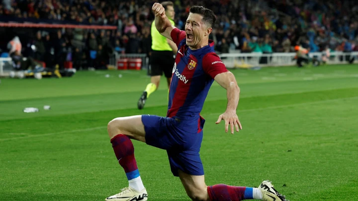 Barcelona's Robert Lewandowski celebrates after scoring their third goal against Valencia. PHOTO: REUTERS