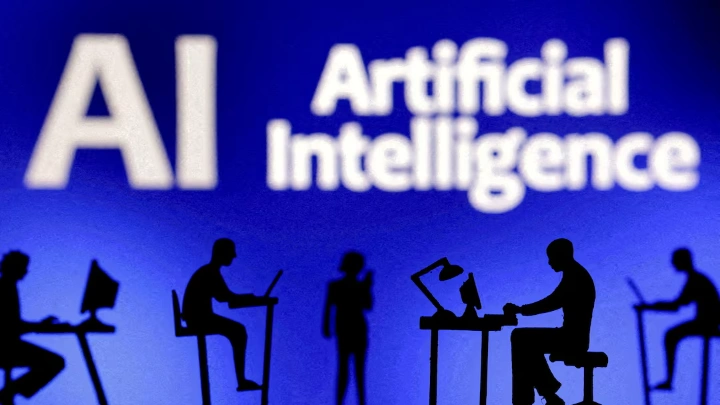 Figurines with computers and smartphones are seen in front of the words "Artificial Intelligence AI" in this illustration taken, February 19, 2024. REUTERS/Dado Ruvic/Illustration//File Photo 