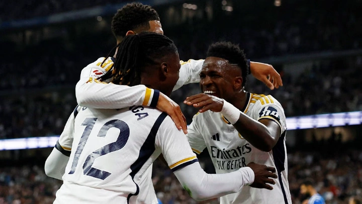 Real Madrid's Vinicius Junior celebrates with Jude Bellingham and Eduardo Camavinga after scoring their second goal. PHOTO: REUTERS