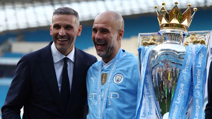 Manchester City manager Pep Guardiola and chairman Khaldoon Al Mubarak celebrate with the trophy after winning the Premier League title. PHOTO: REUTERS