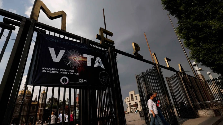 Disinformation war engulfs Mexican presidential race A banner that says "Vote" is displayed over the fence of La Basilica de Guadalupe in Mexico City, Mexico on May 25, 2024. In view of the upcoming June 2 election, it has been said that Mexican presidential front-runner Claudia Sheinbaum wants to make circumcision compulsory and close a revered Catholic church. Mexico faces an election disinformation war, which clouds the debate on social media and sows doubts about the electoral process. Photo: AFP